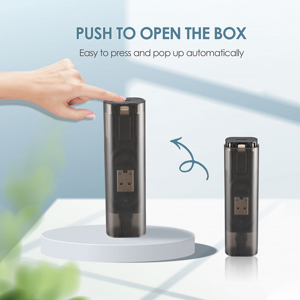 Hand pressing to pop the black USB cable adapter kit open automatically is very convenient