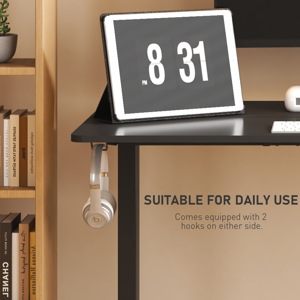 Black standing desk frame with 2 side hooks holding headphones, highlighting its daily use suitability