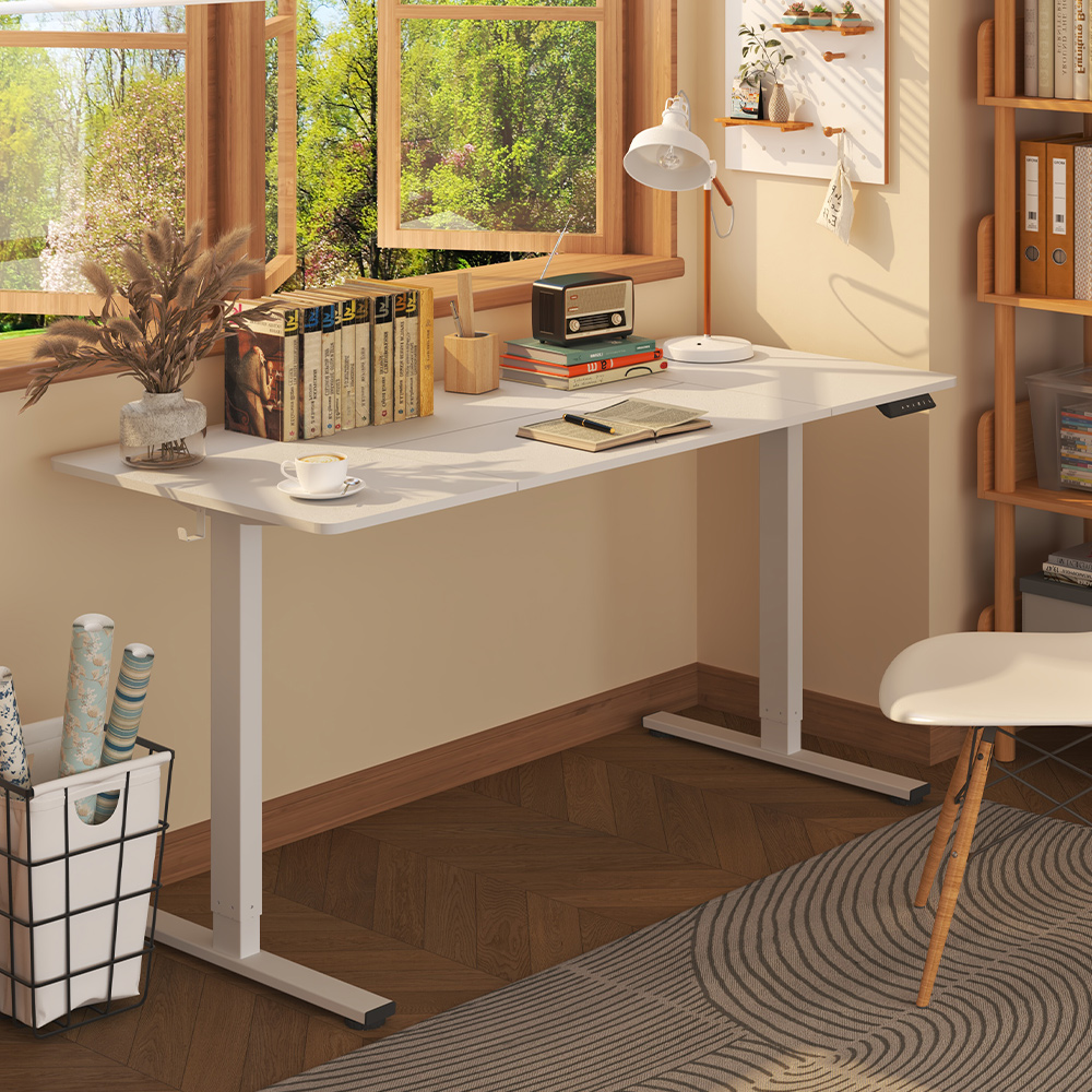 White electric adjustable standing desk frame (with desktop) in a cozy, sunlit home office