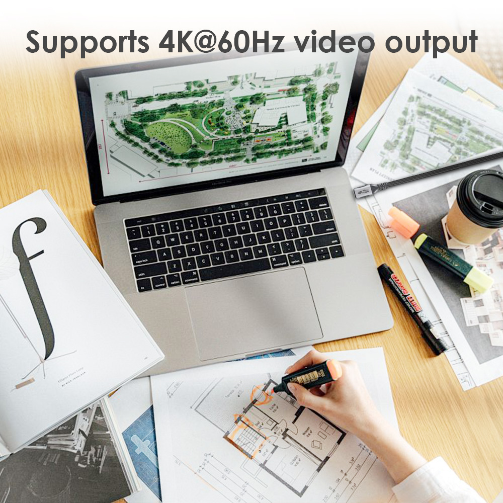 A black USB Type-C cable supporting 4K@60Hz video output is plugged into the laptop