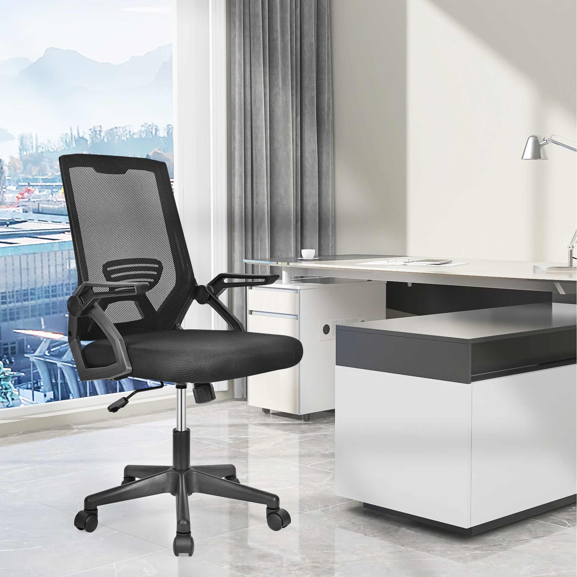 Black mesh rolling office chair is suitable to be placed next to large executive desk in a modern office space