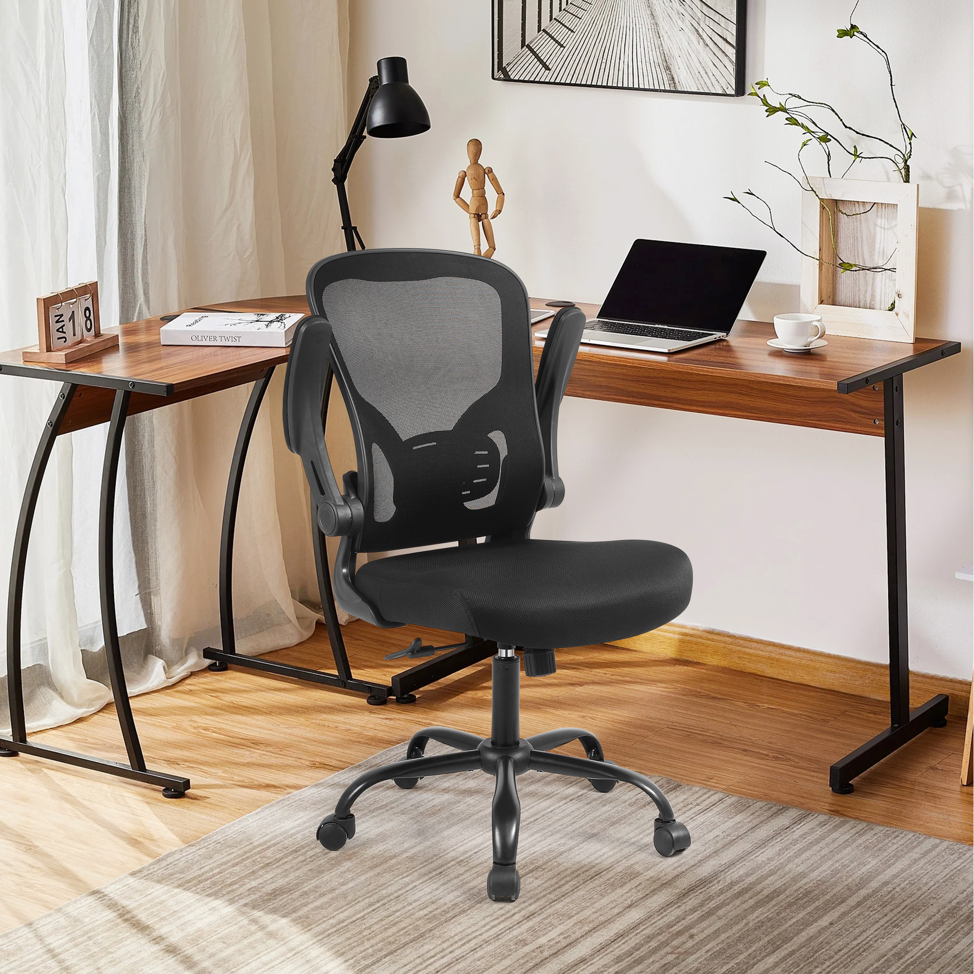 This black ergonomic mesh office chair is equipped with adjustable armrests for greater comfort
