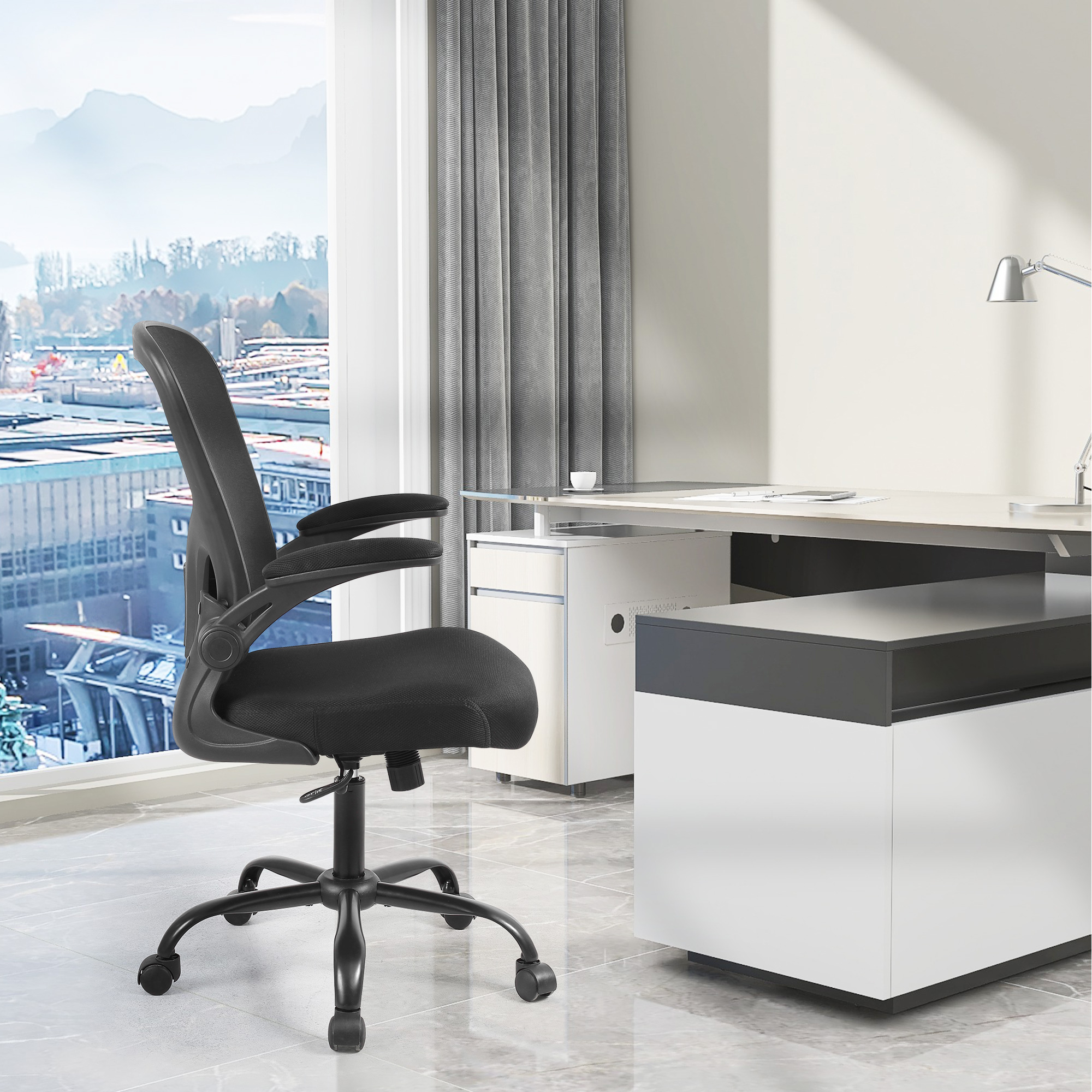 You can put down the armrests when you use this ergonomic mesh office chair in the office