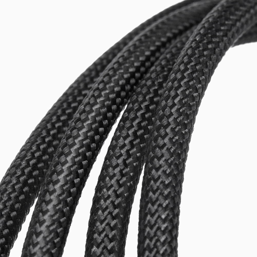 Close up detail of durable black woven nylon braided exterior of high speed Thunderbolt USB4 cable