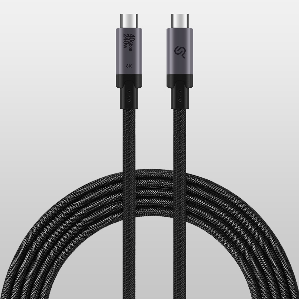 Full coiled black braided PrimeCables USB4 Thunderbolt cable with two aluminum USB-C connectors