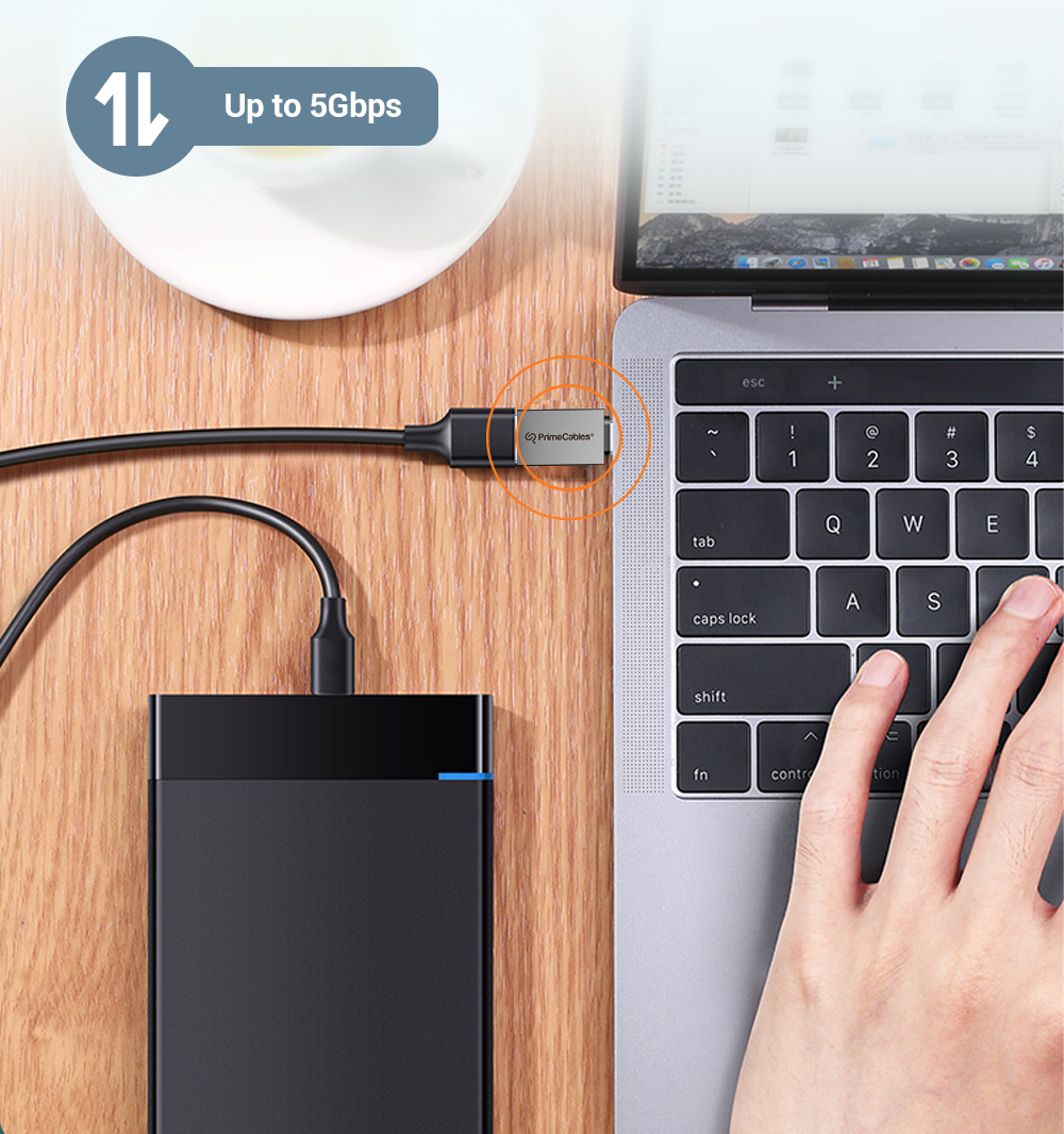 USB-C to USB-A adapter connected a laptop to a portable drive with a data transfer speed of up to 5Gbps