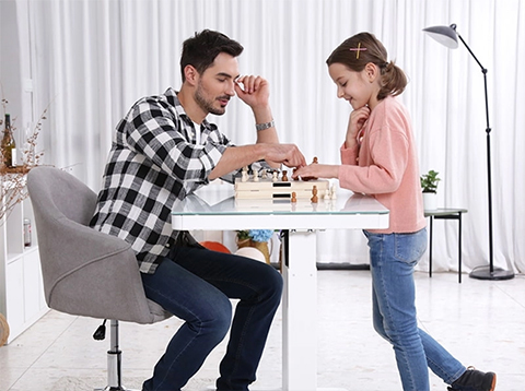father and daughter playing chess on PrimeCables® Cab-PC-08267 With Wooden Table Top